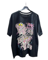 Black tshirt with colorful graphic design of Pink Panther on a hanger against a white background
