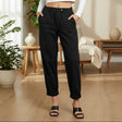 Person wearing black pants in a living room setting