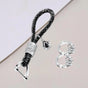 Black crystal wrapped keychain loop with a faceted teardrop charm and two spare stone set rings