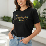 Black tshirt with colorful text worn outdoors