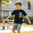 Boy wearing a black Sonic t shirt with grey printed shorts, Jack Gifts Online Lebanon