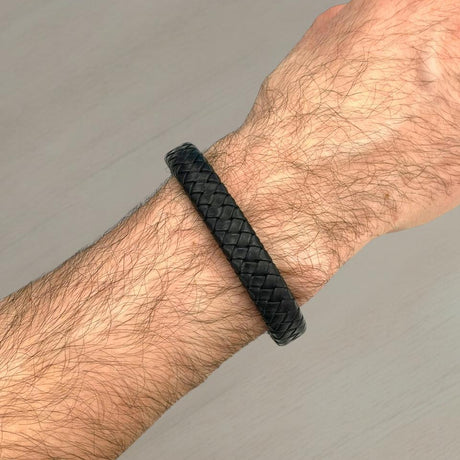 Thick braided black leather bracelet worn on a wrist, Jack Gifts Online Lebanon