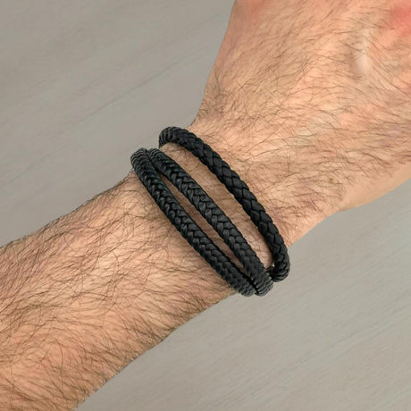 Three thin braided black leather bracelets worn on a wrist, Jack Gifts Online Lebanon