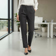 Person wearing black trousers in an office setting