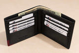 Black leather bifold wallet with a burgundy corner, open with notes and cards inside