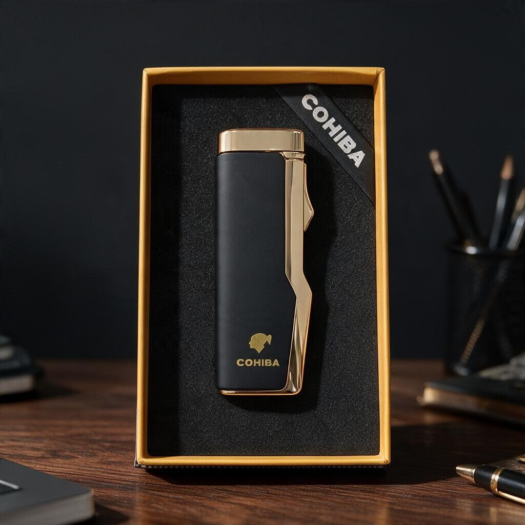 Slim matte black cigar lighter with a polished gold top and side in a gold edged box