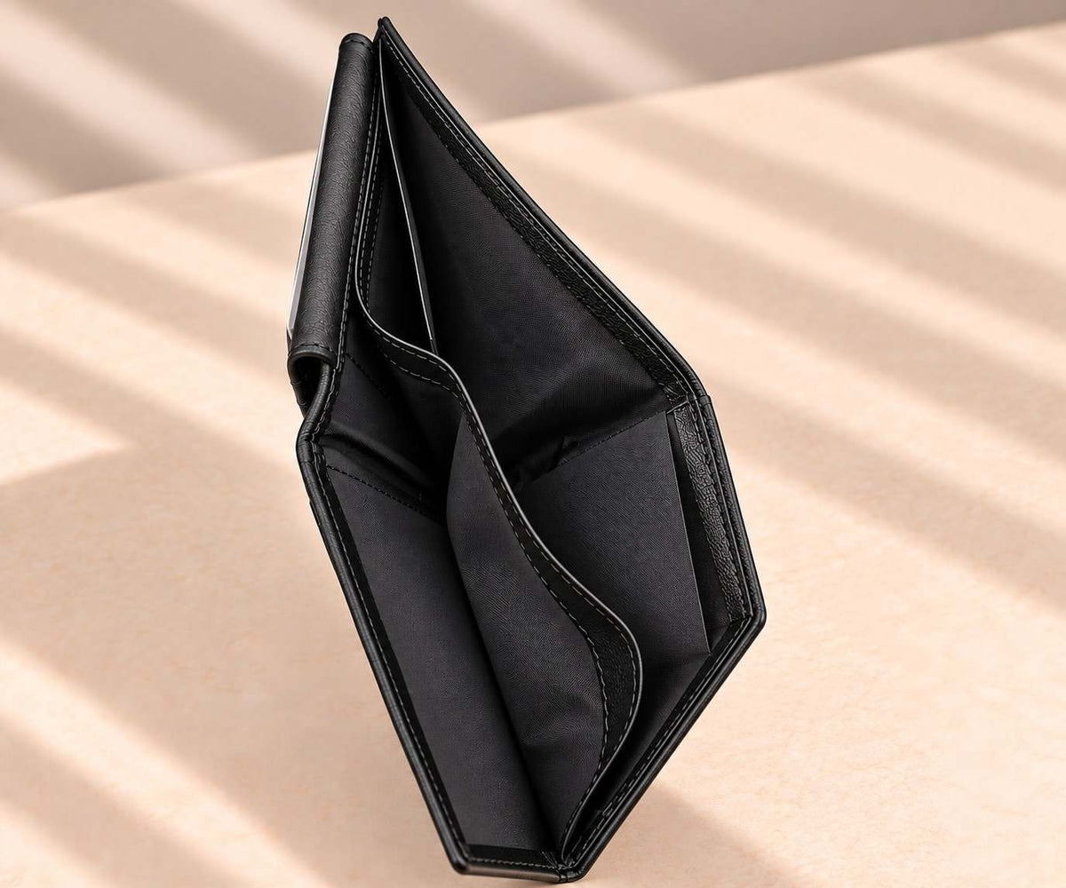Upright black leather wallet opened slightly to show its inner pockets