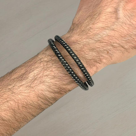Black leather bracelets braided with silver threads worn on a wrist, Jack Gifts Online Lebanon