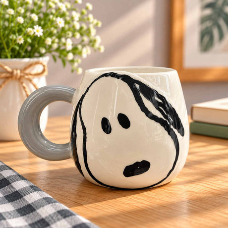 Thick brush lines form an oversized cartoon dog face, grey ring handle at the side
