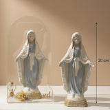 Cased and bare Marian statues on a beige backdrop, one marked 20 cm