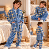 Boy in a blue and yellow plaid fleece robe with matching top and plain blue trousers