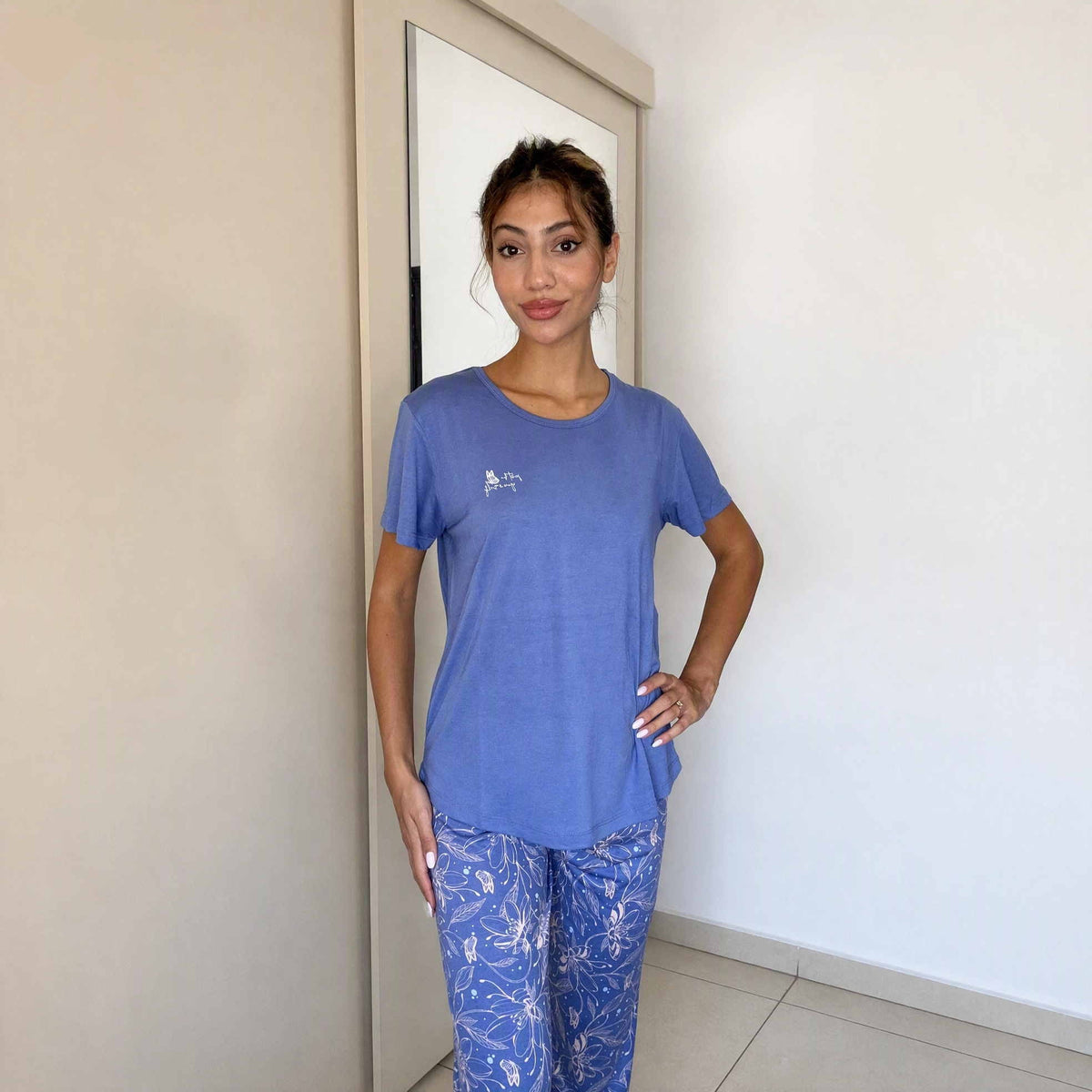 Blue pyjama set with a plain top and trailing floral print on the bottoms
