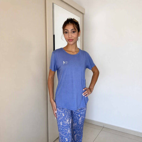 Blue pyjama set with a plain top and trailing floral print on the bottoms