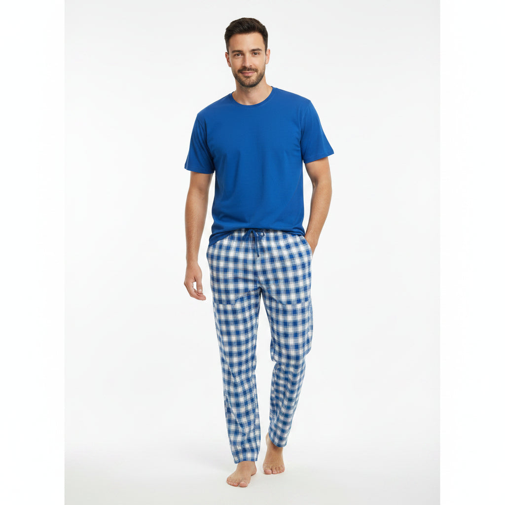 Blue checkered pyjama set worn standing on a white background
