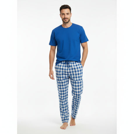 Blue checkered pyjama set worn standing on a white background