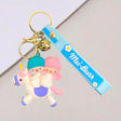 Keychain with cartoon characters and a blue band featuring 'Mei Bear' on a light grey background