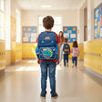 Boy wearing a blue dino face school backpack in a school hallway