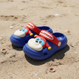 Kids blue clogs with a 3D puppy face and red back strap