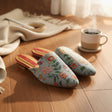 Pale blue floral tapestry mules with a pointed toe and red trim