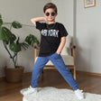 Boys set with a black New York graphic tee and blue cuffed joggers, worn with white sneakers