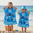 Kids wearing blue Stitch hooded poncho towels at the beach – Jack Gifts Online Lebanon