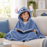 Blue hooded Stitch blanket worn on a sofa with the hood up and snaps fastened