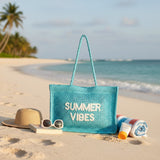 Turquoise woven Summer Vibes beach bag on white sand – Jack Gifts Online Lebanon
