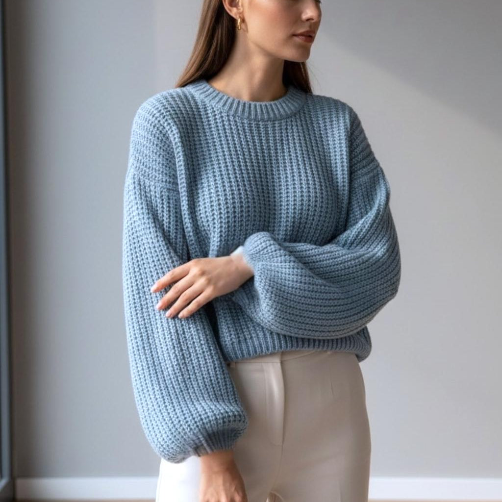 Pastel blue chunky knit jumper, puff sleeves gathered at the cuff, side angle
