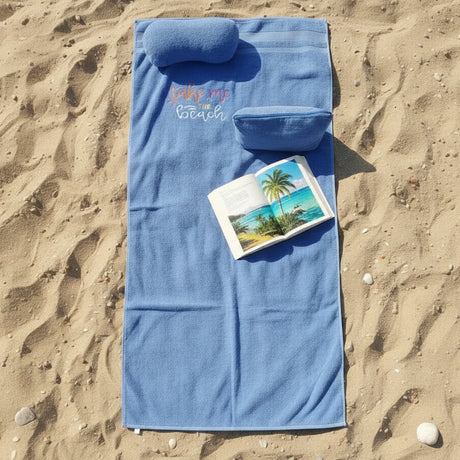 Blue towel set with text on the beach