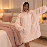 Blush hooded blanket shown with one sleeve out to show the oversized cut