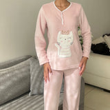 Blush pink fleece pyjama set with a white crown cat applique and piped button neck