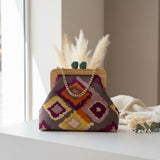 Front view of boho pattern crochet handbag with multicolor weave