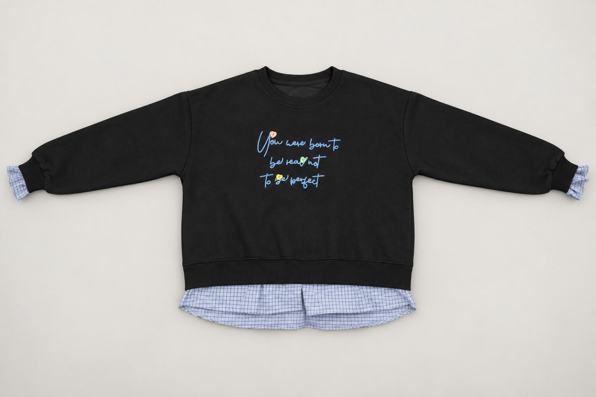 Black sweatshirt with light blue script embroidery and a blue gingham hem, laid flat