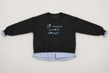 Black sweatshirt with light blue script embroidery and a blue gingham hem, laid flat