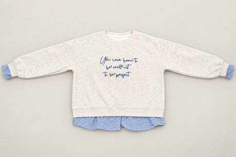 Grey marl crew neck laid out flat, navy script across the chest and blue frills at each wrist