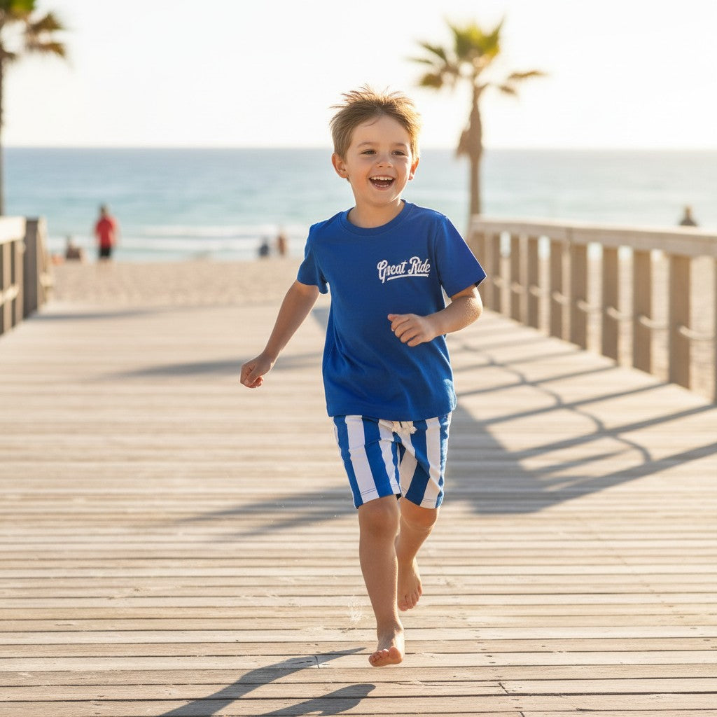 Child running on a wooden boardwalk by the beach