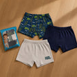 Three boys boxers in a navy game controller print, plain navy and grey with lettering beside the pack