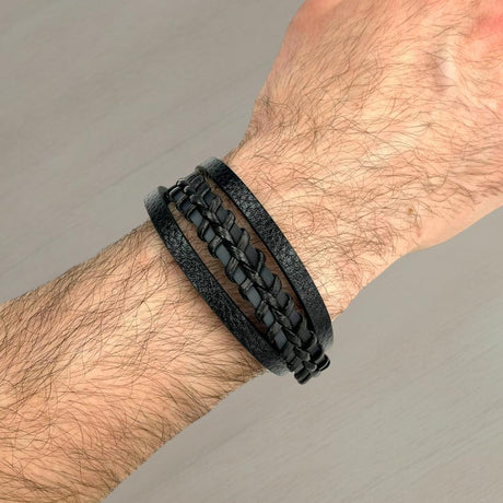 Black leather bracelet with a woven centre strand worn on a wrist, Jack Gifts Online Lebanon