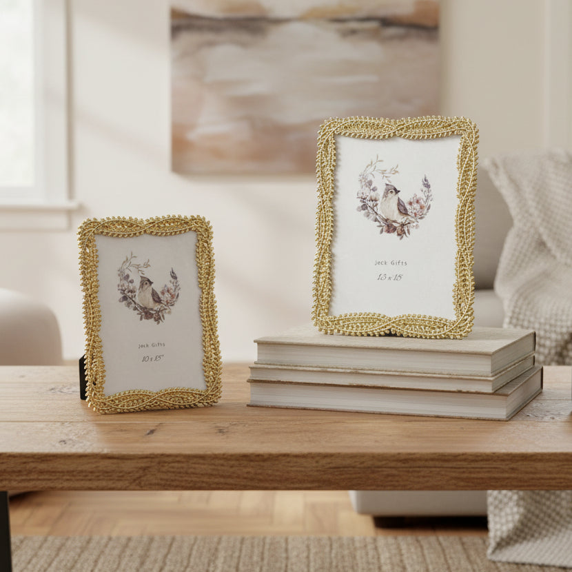 Gold braided rope frames in two sizes, the larger propped on a stack of books