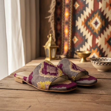 Colorful breathable handmade slippers on a wooden table