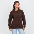 Dark brown brushed wool crew neck sweater with ribbed cuffs and hem, worn with light jeans