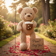 Tan curly teddy bear with a boba cup plush on a rose petal garden path