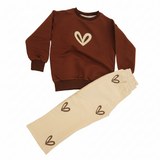 Brown sweatshirt and cream joggers laid flat showing the heart prints