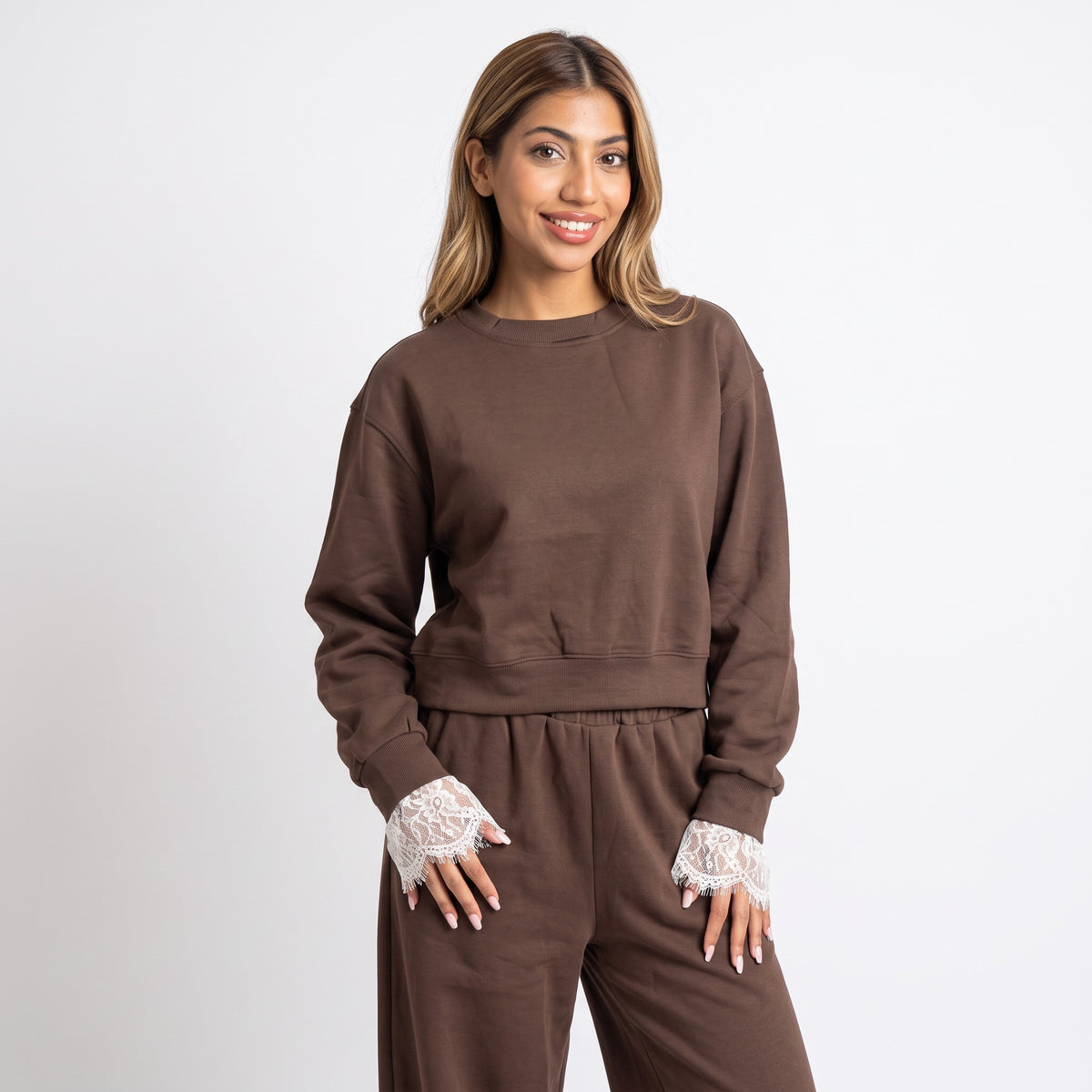 Chocolate brown lace trim set photographed on a plain backdrop