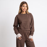 Chocolate brown lace trim set photographed on a plain backdrop