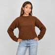 Rust brown cropped mock neck sweater with a ribbed hem, hands on hips with light jeans