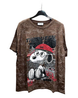 Brown tshirt with graphic design of snoopy wearing a red cap on a hanger