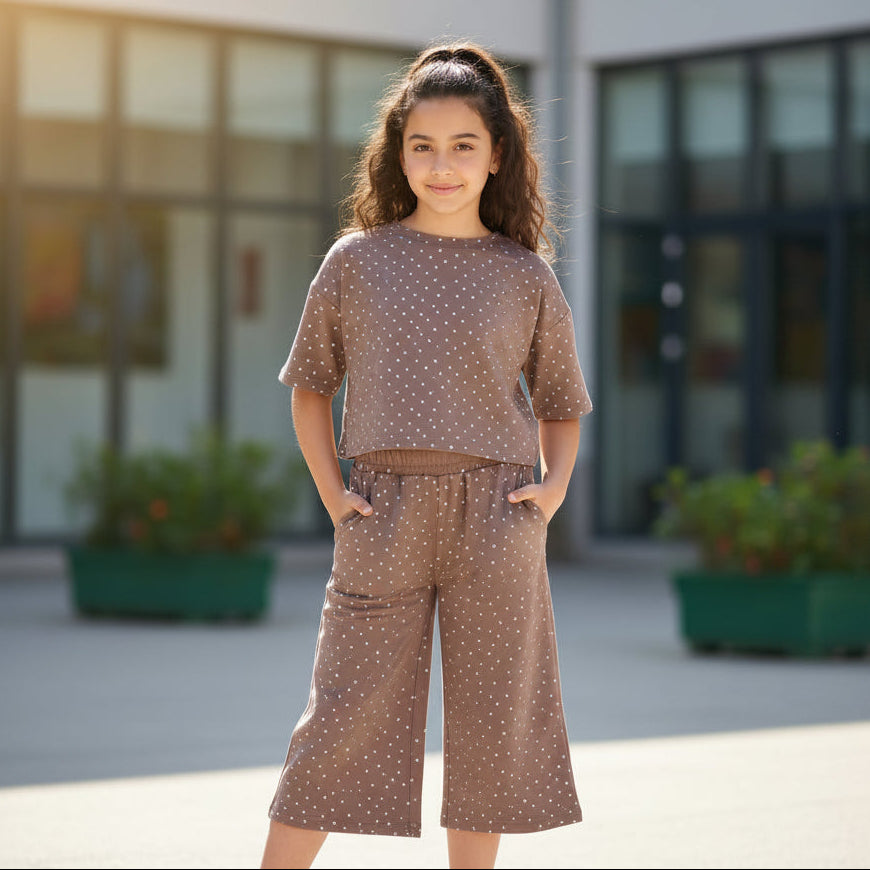 Girl in a brown polka dot tee and matching wide leg culottes