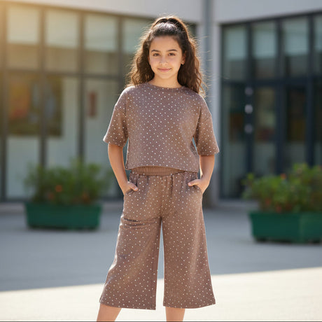 Girl in a brown polka dot tee and matching wide leg culottes