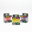 Three NeeDoh Nice Cube squish toys in red, yellow and purple displayed in their retail boxes